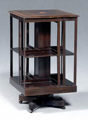 Appraisal: Georgian style rotating book stand inlaid figured mahogany top over