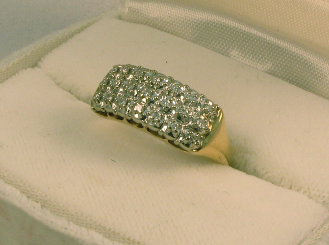 Appraisal: DIAMOND AND FOURTEEN KARAT GOLD CLUSTER RING set with round-cut