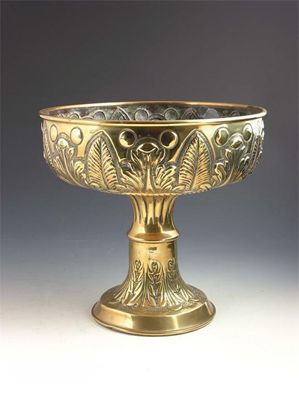 Appraisal: A th century embossed brass stem bowl with a loaded