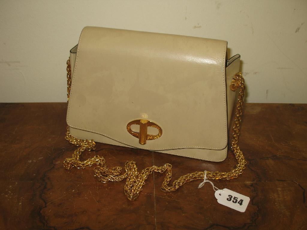 Appraisal: Dunhill A cream leather shoulder bag with gilt metal chain