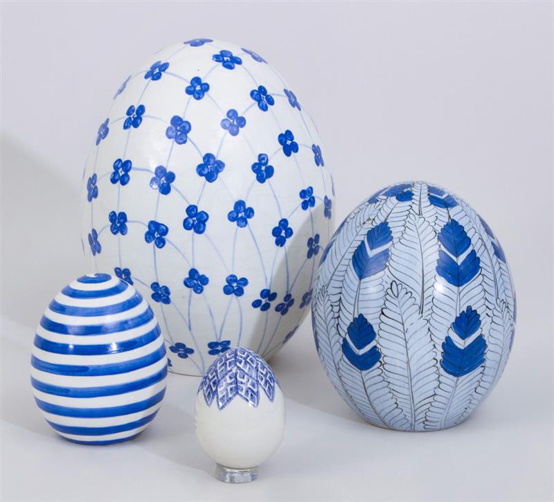 Appraisal: FOUR CONTEMPORARY BLUE AND WHITE GLAZED POTTERY EGGS to in