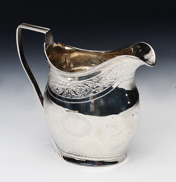 Appraisal: A GEORGIAN SILVER CREAM JUG of baluster form with loop