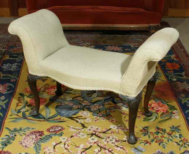 Appraisal: AN ANTIQUE MAHOGANY AND UPHOLSTERED WINDOW SEAT of serpentine fronted