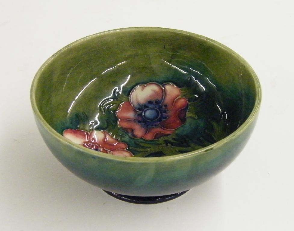 Appraisal: Moorcroft 'Anemone' design circular footed bowl decorated upon a mottled