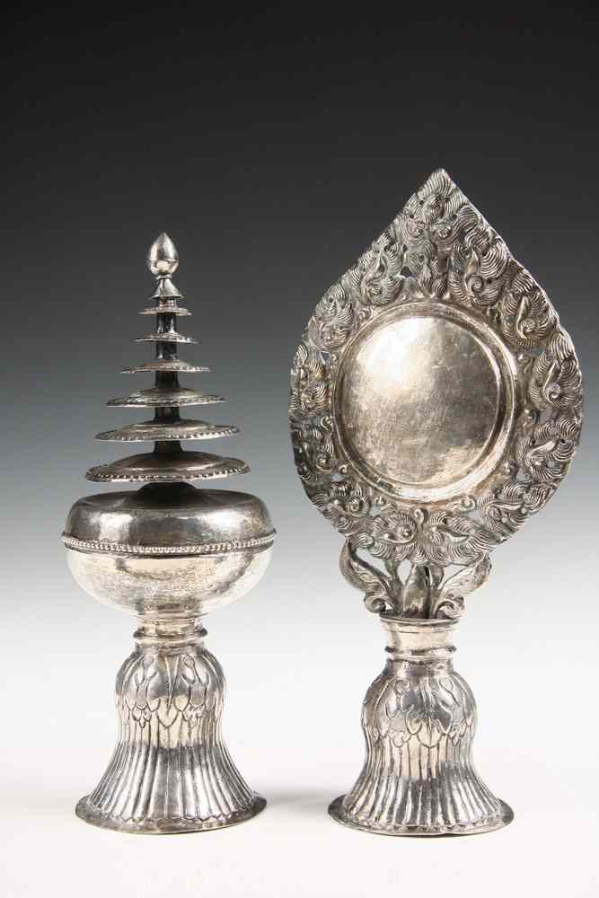 Appraisal: TIBETAN SILVER ALTAR ORNAMENTS - Both th c in repousse