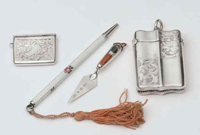 Appraisal: AN EDWARDIAN SILVER STAMP HOLDER in the form of a