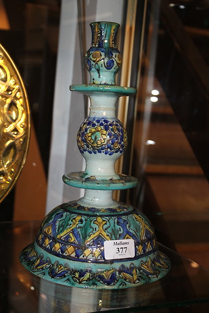 Appraisal: A MOORISH GREEN AND BLUE GLAZE CANDLESTICK of tiered form