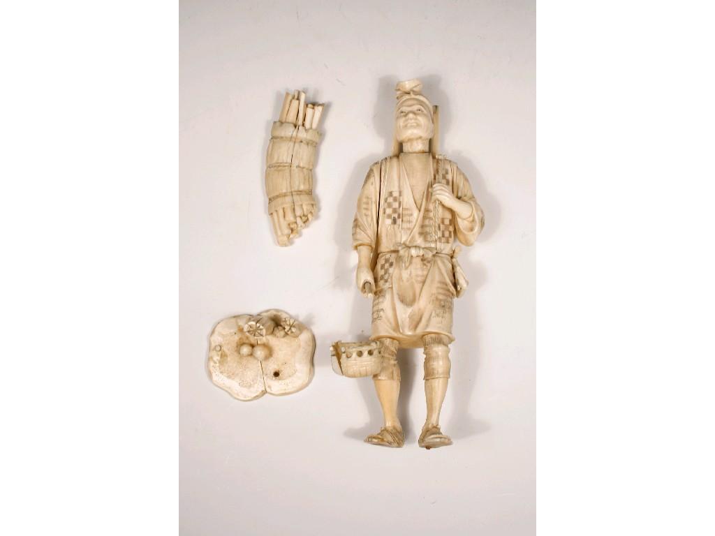 Appraisal: A JAPANESE IVORY SECTIONAL OKIMONO of a wood gatherer wearing