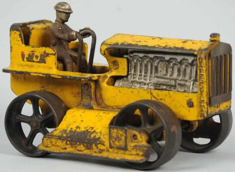 Appraisal: Cast Iron Arcade Caterpillar Tractor Toy Includes original nickel driver