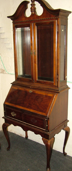 Appraisal: A mahogany bureau bookcase th century the swan neck pediment