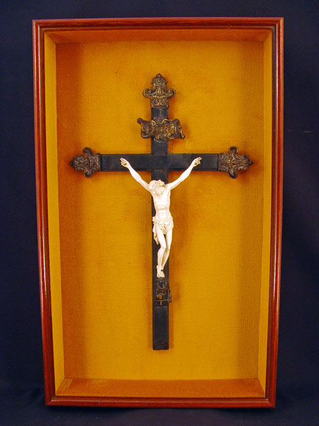 Appraisal: EBONY IVORY CRUCIFIX Ebony and tooled metal crucifix with carved