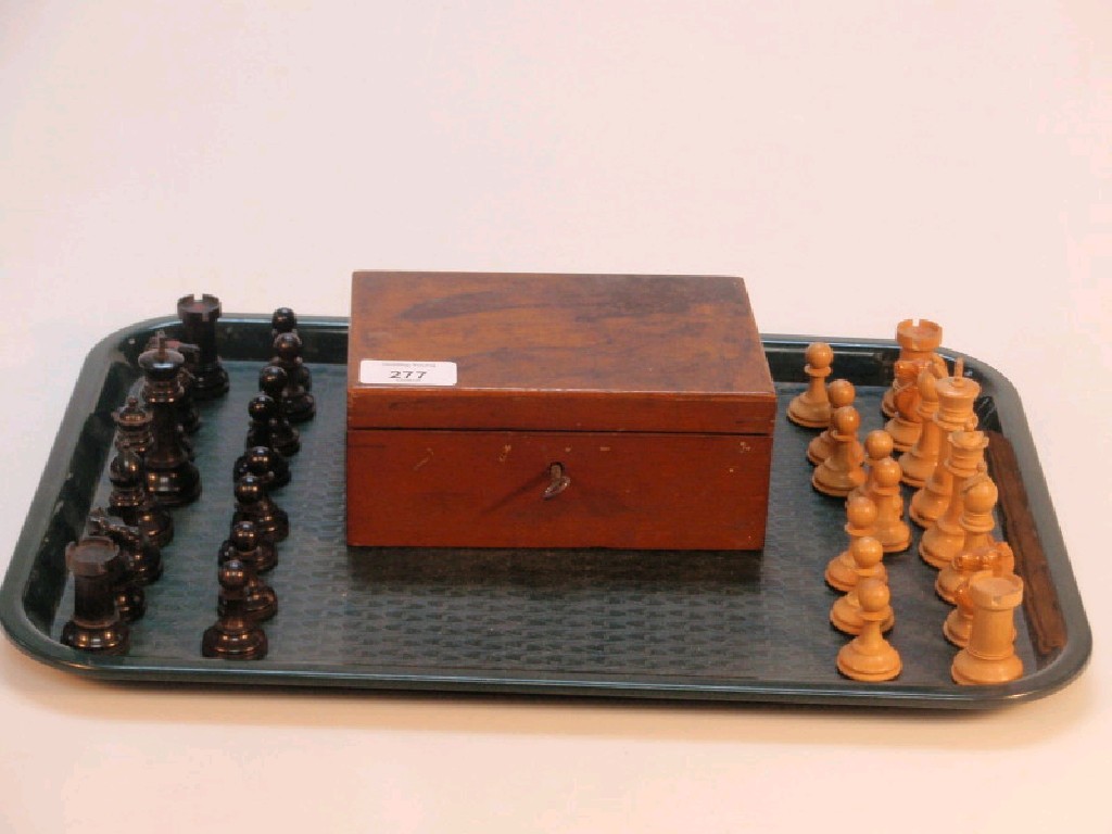 Appraisal: A Staunton pattern chess set both colours having a knight