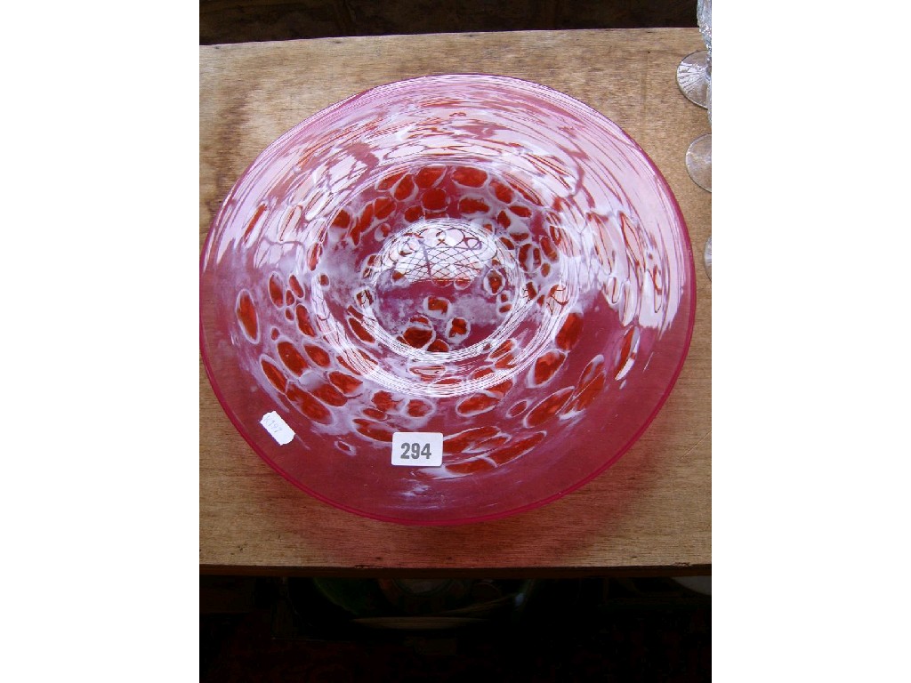 Appraisal: A glass charger with pink and white marbled finish