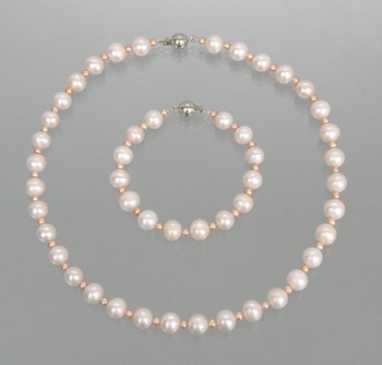 Appraisal: A String of Pink Cultured Pearls and Matching Bracelet Hand-knotted