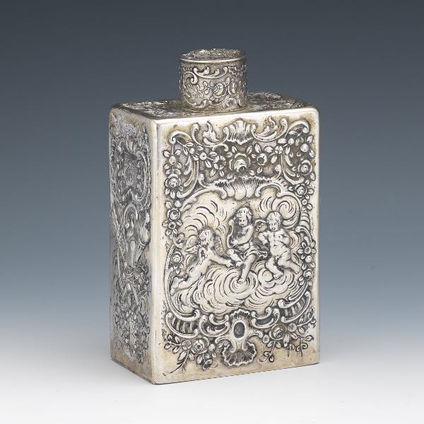 Appraisal: SILVER TEA CADDY x x Silver flask with lid depicting