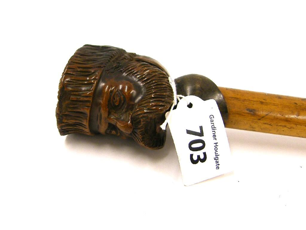 Appraisal: Walking cane the finial carved with the head of a