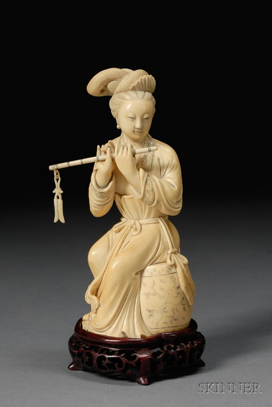 Appraisal: Ivory Carving China figure of a seated woman playing a