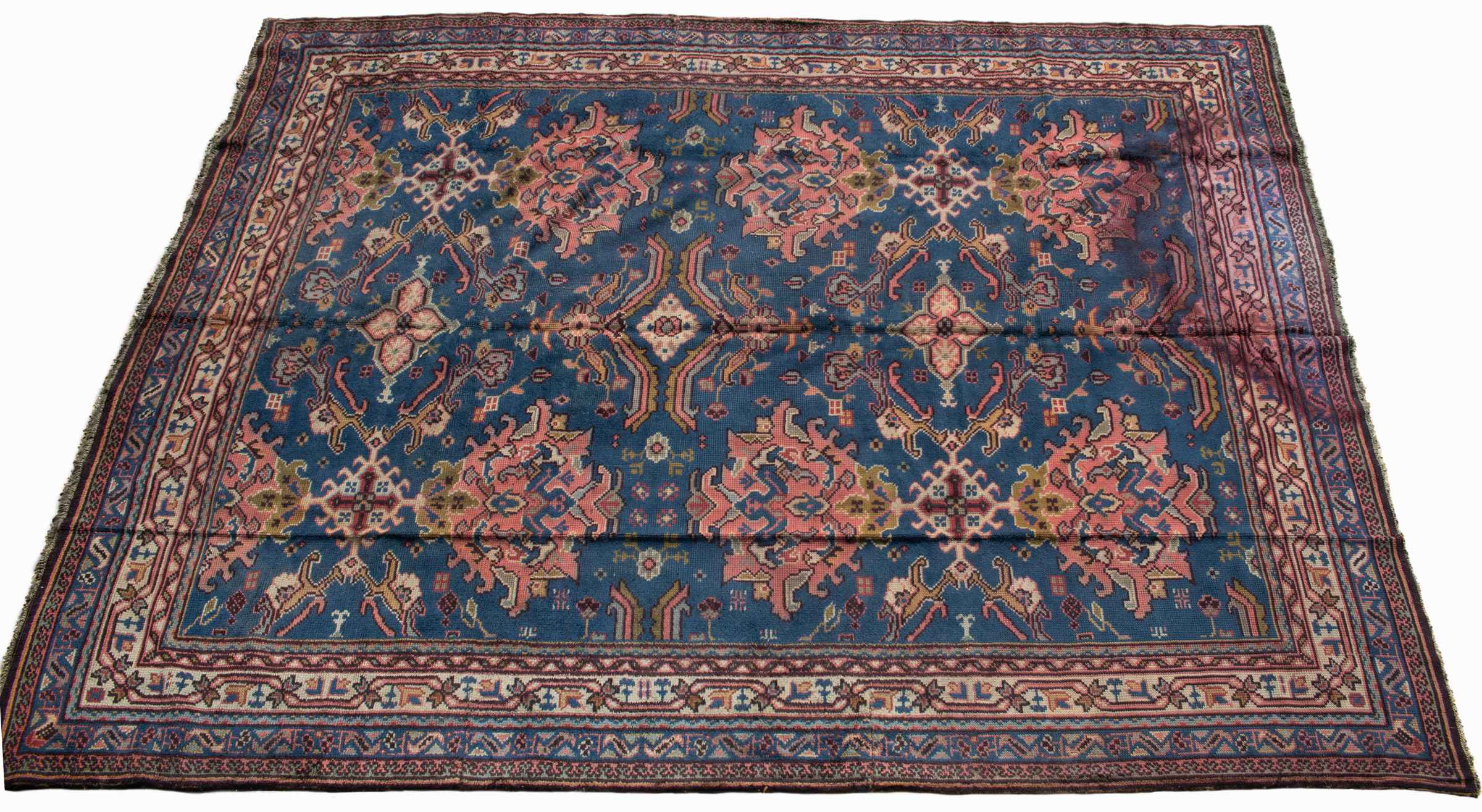 Appraisal: A blue ground Turkey carpet with geometric floral motif to