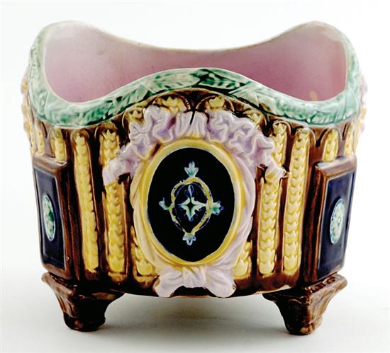 Appraisal: French majolica cachepot th century laurel wreath-bound trefoil form molded