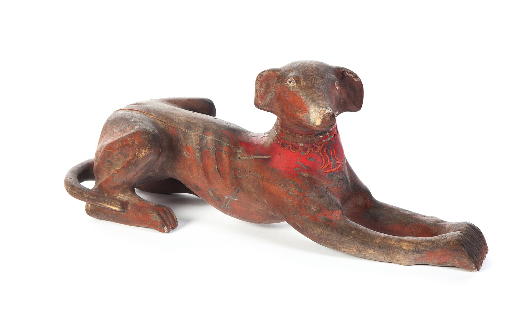 Appraisal: CARVED WOODEN DOG Probably Asian th century Reclining dog with