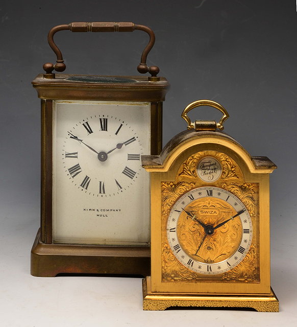 Appraisal: A FRENCH BRASS CARRIAGE TIMEPIECE with white enamel dial and