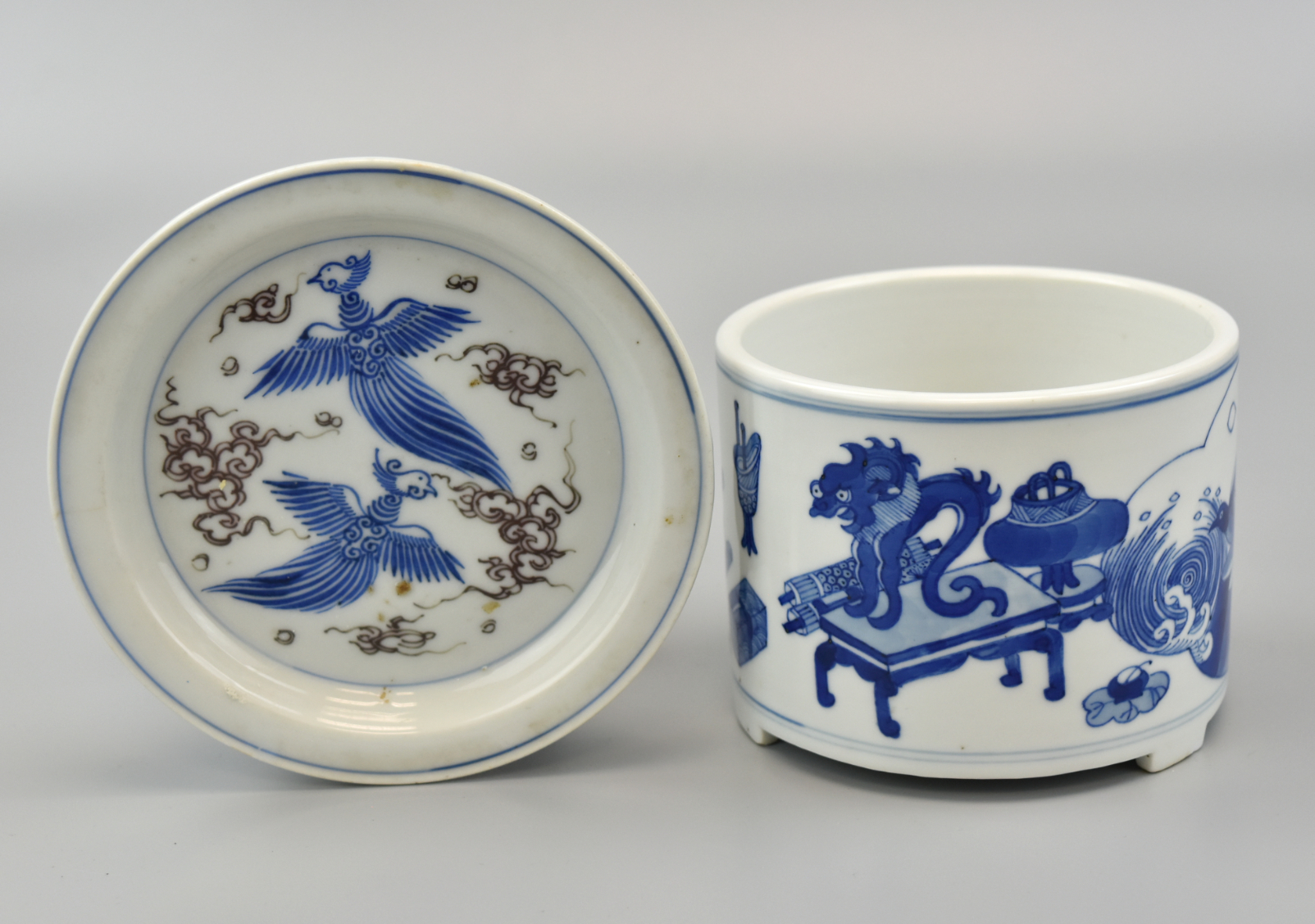 Appraisal: Chinese blue and white brushbot with design of classically Chinese