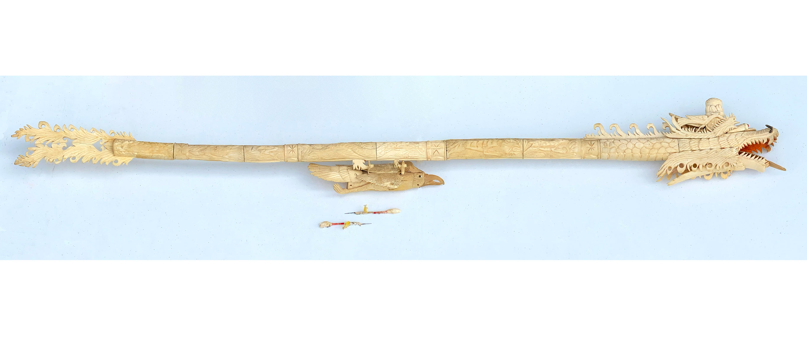 Appraisal: CARVED BONE DRAGON MOTIF BLOW GUN WITH DARTS Approx ''