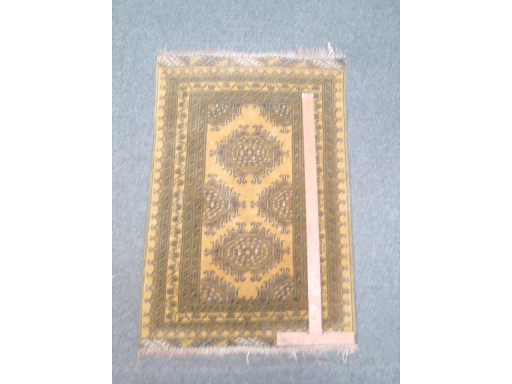 Appraisal: A beige ground multi-border rug cm x cm