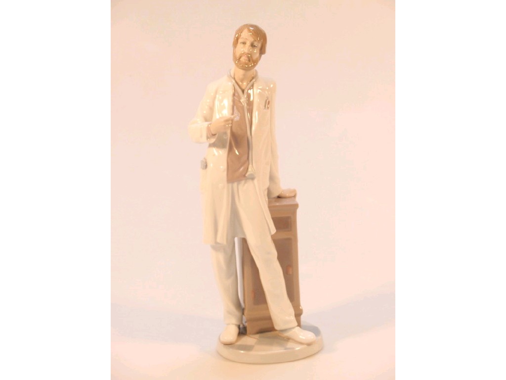 Appraisal: A Lladro figure of a Doctor standing by a cabinet