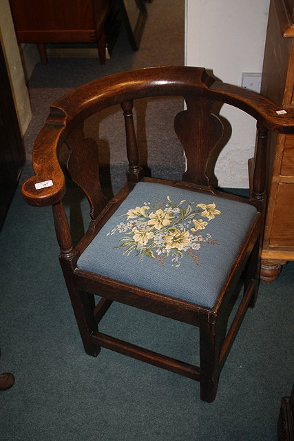 Appraisal: A GEORGE III OAK CORNER CHAIR with vase-shape splat back