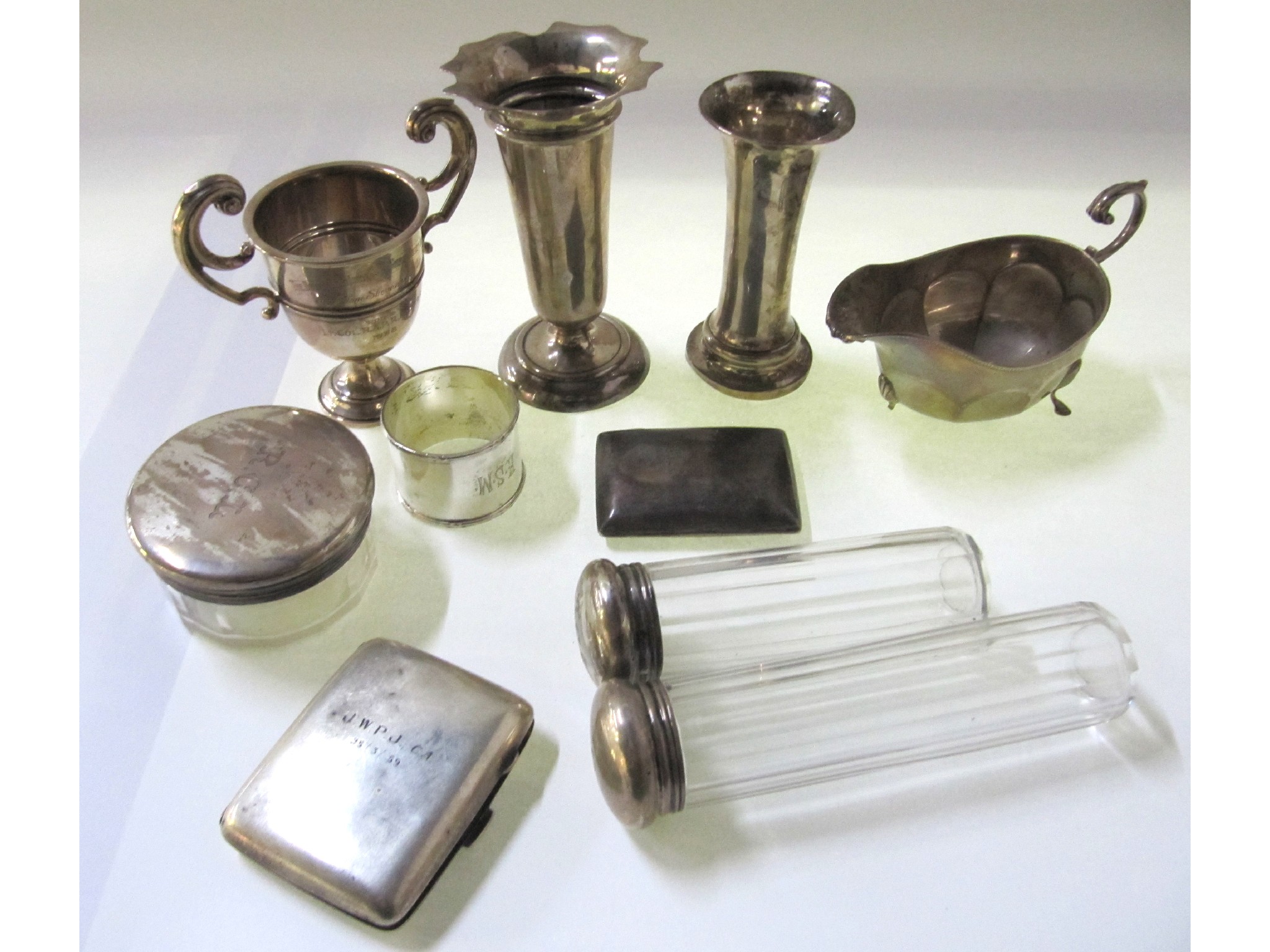 Appraisal: A lot comprising silver vases trophy cup cigarette cases sauceboat