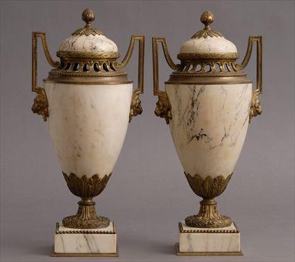 Appraisal: PAIR OF LOUIS XVI-STYLE GILT-METAL MOUNTED VEINED MARBLE URNS AND