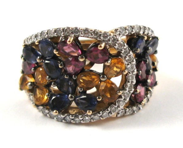 Appraisal: MULTI-COLOR GEMSTONE AND DIAMOND RING The heavy k gold ring