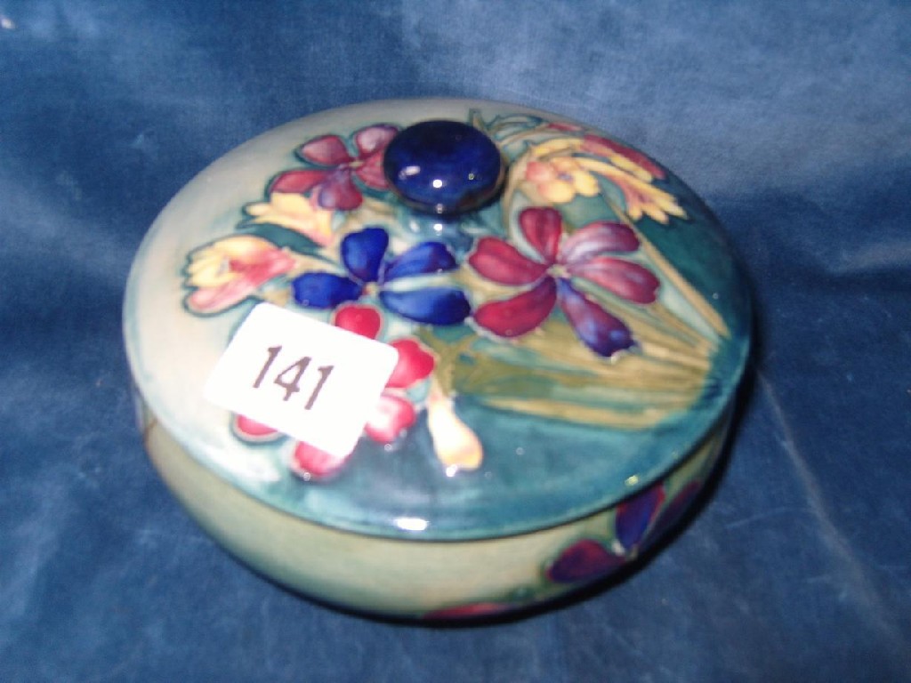 Appraisal: A Moorcroft green ground powder bowl and cover with painted