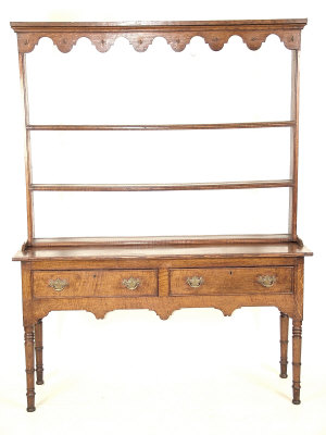 Appraisal: A George IV oak dresser with associated plate rack the