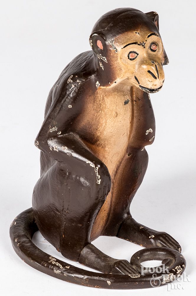 Appraisal: Cast iron monkey doorstop early th c Cast iron monkey