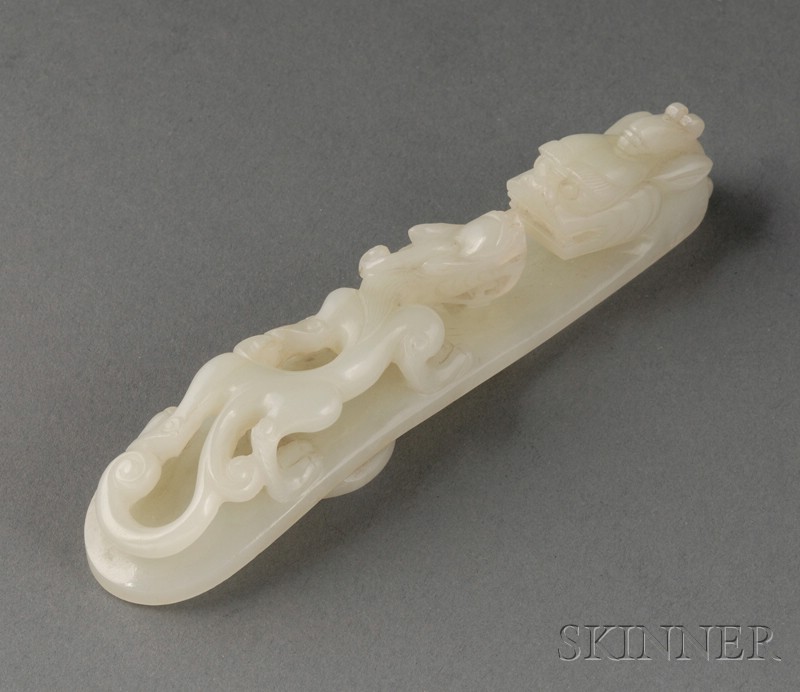 Appraisal: Jade Garment Hook th century greenish-white stone dragon-head finial body