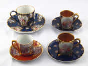 Appraisal: A ceramic teacup and saucer with hand painted panels of