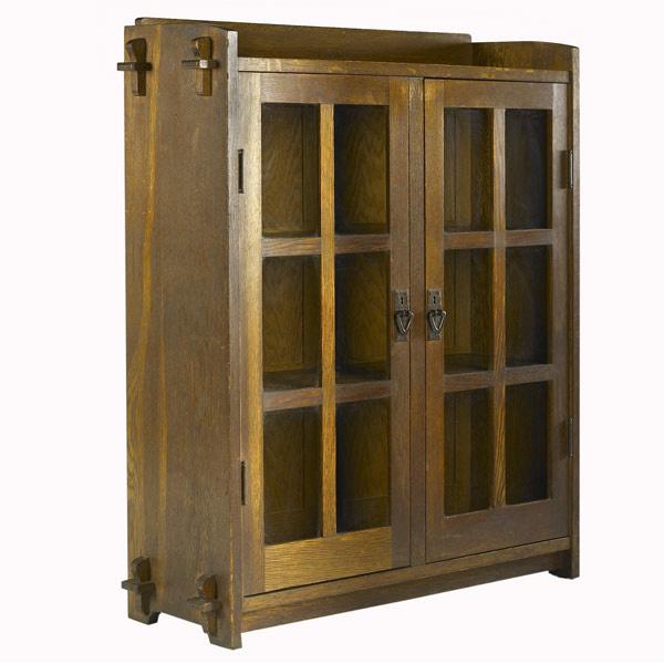 Appraisal: GUSTAV STICKLEY Diminutive double-door bookcase with keyed through-tenon contruction and