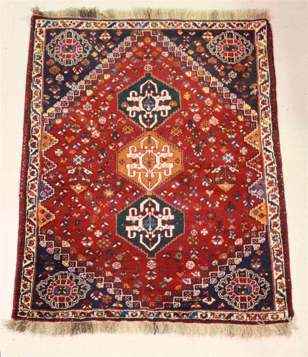 Appraisal: SHIRAZ THREE MEDALLION WOOL RUG with wool foundation in red