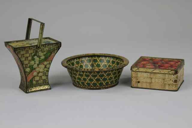 Appraisal: THREE BASKET FORM BISCUIT CONTAINERS Lithographed tinplate comprising a Meredith