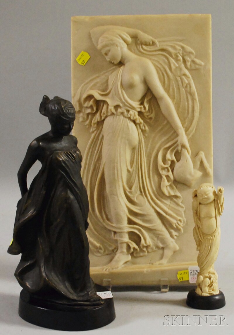 Appraisal: Decorative Plaque and Two Figural Items a cast resin plaque