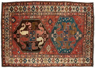 Appraisal: Caucasian rug two green and brown central medallions with cloud