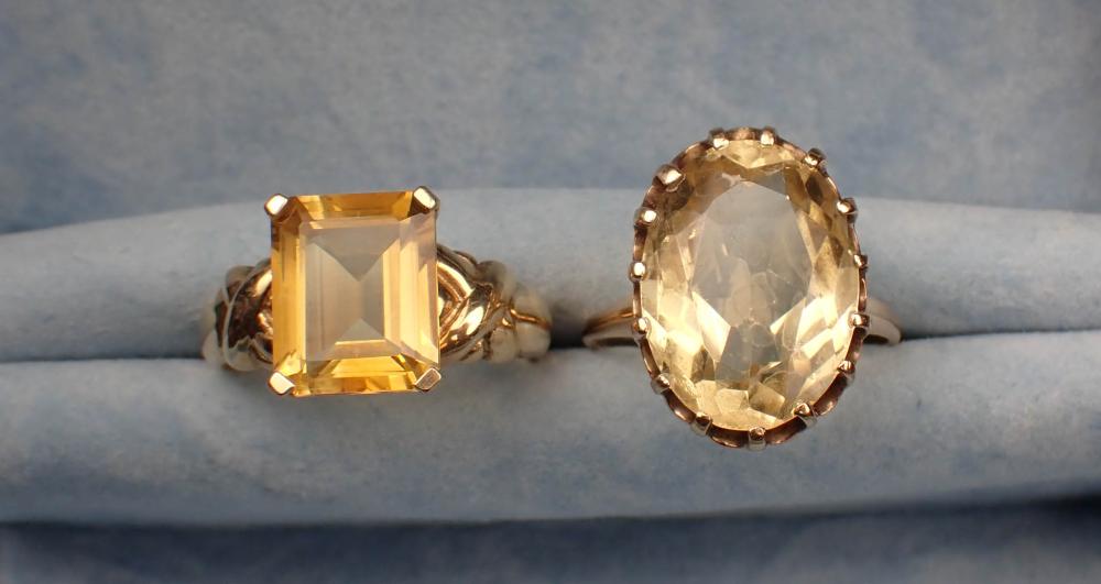 Appraisal: TWO CITRINE AND YELLOW GOLD SOLITAIRE RINGS size - k