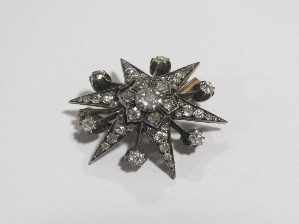 Appraisal: Victorian gold diamond set star brooch set throughout with rose