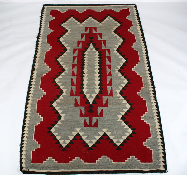 Appraisal: Navajo blanket rug central geometric design x Good condition mild