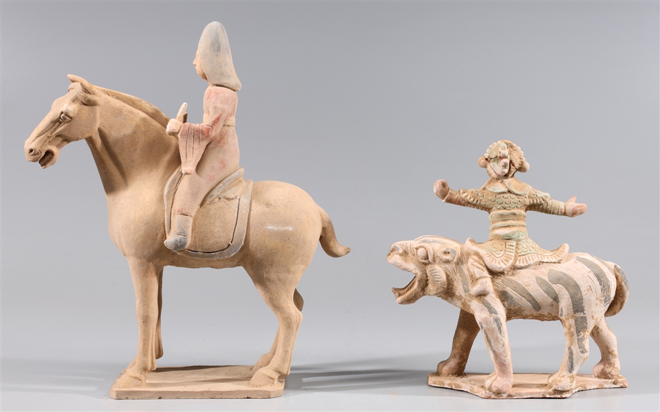 Appraisal: Two Chinese pottery figures one seated atop horse the other