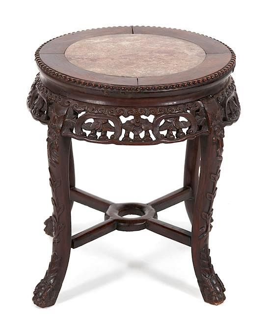 Appraisal: A Chinese Carved Hardwood Table with Inset Marble Top Height