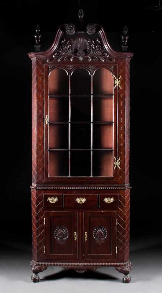 Appraisal: Classical Revival mahogany glass panel door corner cupboard late th