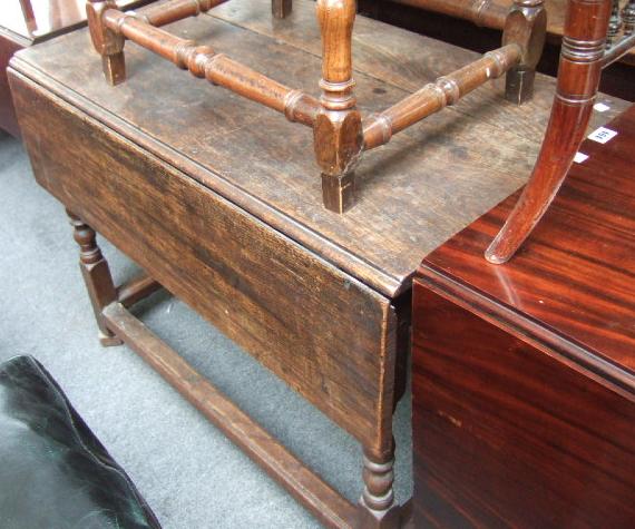 Appraisal: An th century oak drop flap table with single end